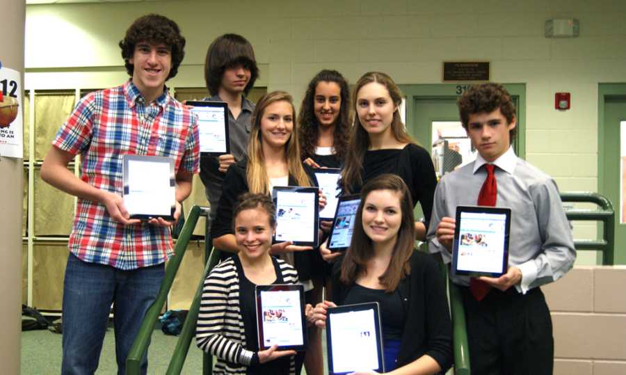 Upper School journalists have revolutionized The Gauntlet, the school newspaper. Staff members are (starting at top left, clockwise) sophomore Austin Siegel, junior Stefan Wolfe, senior Amber Falkner, sophomore Isabelle Bermudez, senior Aiste Zalepuga, freshman Luc Goeders, junior Devon Tallman and junior Monique Chicvak. 