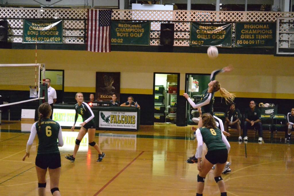 Senior Amanda Everhardus went airborne to spike the ball in the varsity volleyball match against the Braden River Pirates.
