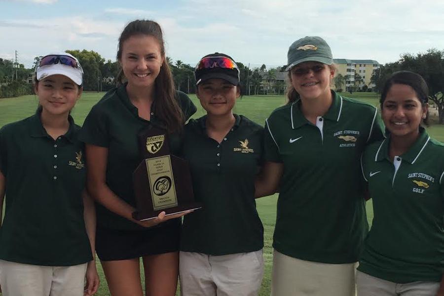 The Falcons Varsity Girls' Golf Team poses with their 2014 Regional Championship Trophy. Left to right: Vanessa Yan ‘17, Natalie Pleyerova ‘15, Michelle Yan ‘16, Kendall Miller ‘18 and Nupur Mathur ‘16