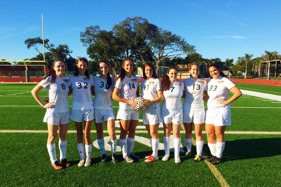 The senior Falcons Pose before beating Southeast 3-1. Left to right are seniors Jane Lindsay, Kassandra Woodruff, Paige Lindsay, Lindsay Barton, Caroline Gregory, Faith Rodriguez, Bryce Liebel and Jenna Turner.