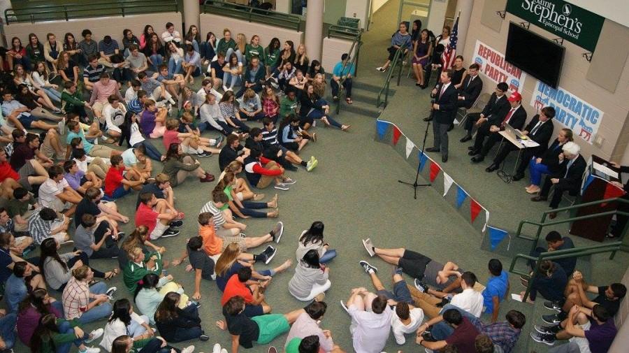 Students look on as the candidates discuss the issues. 