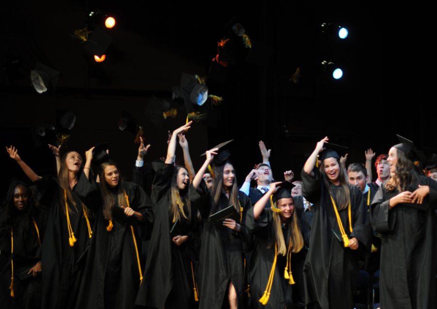 Seniors to don caps and gowns one month early