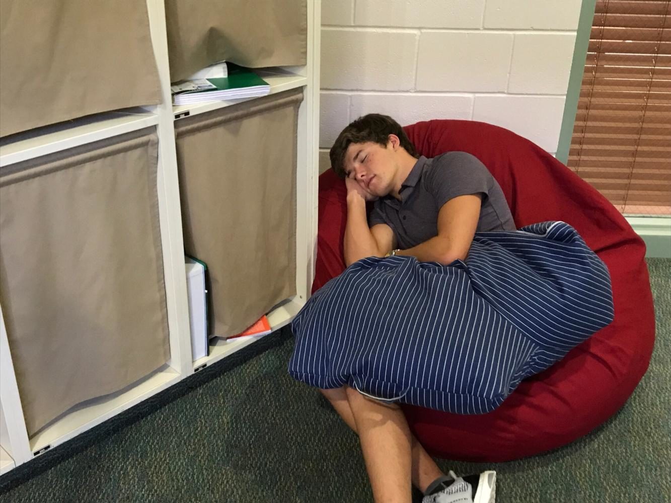 SSES student Nicky Mattheys takes a nap in the hallway.