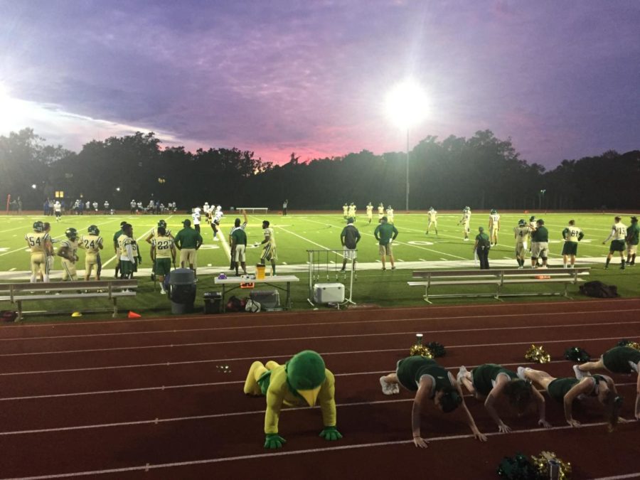 Freddy Falcon and the cheerleaders do push ups to signify a Falcon touchdown