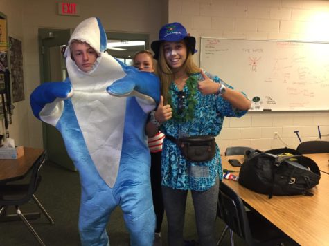 The onsie, seen here in shark form, is an easy, effective last minute choice that can be found at Target or Walmart.  Pictured: Wyatt Sevin and Jackie Schlossberg.  