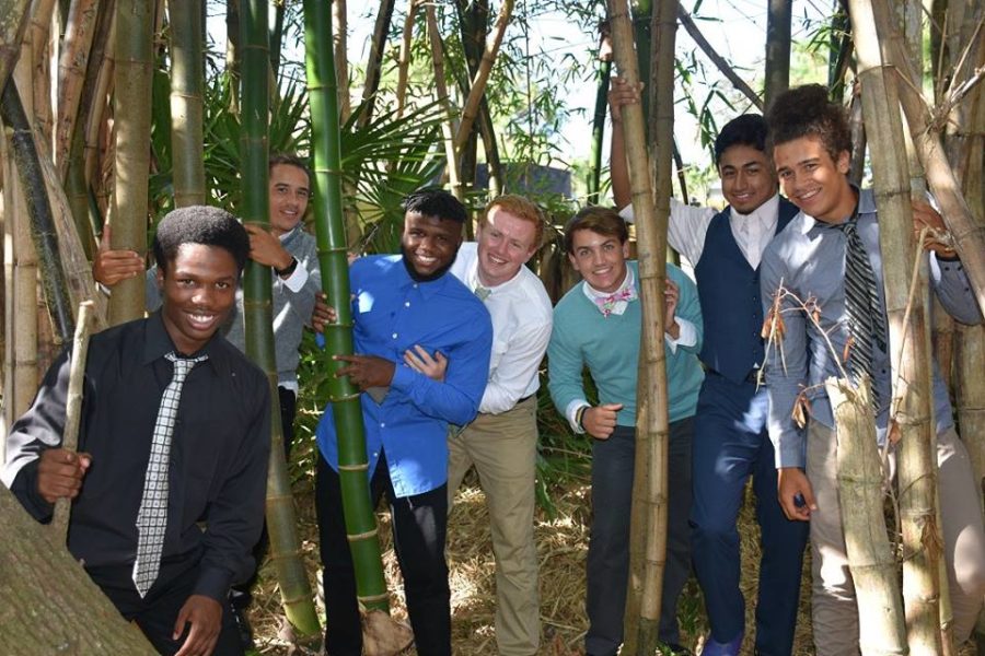 Senior football players pose for a picture