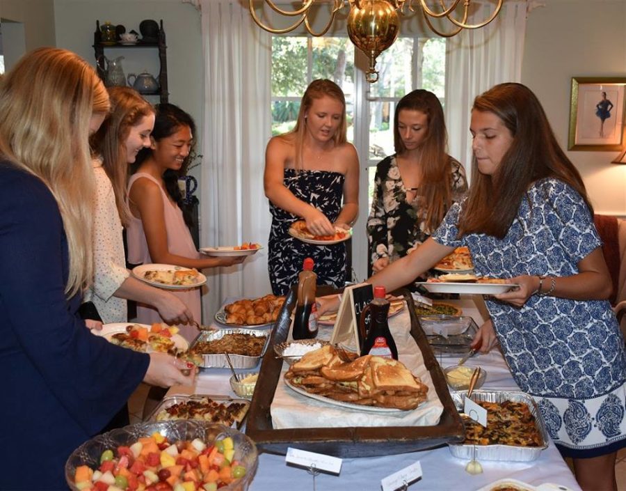 Seniors picking their foods from the delicious breakfast options