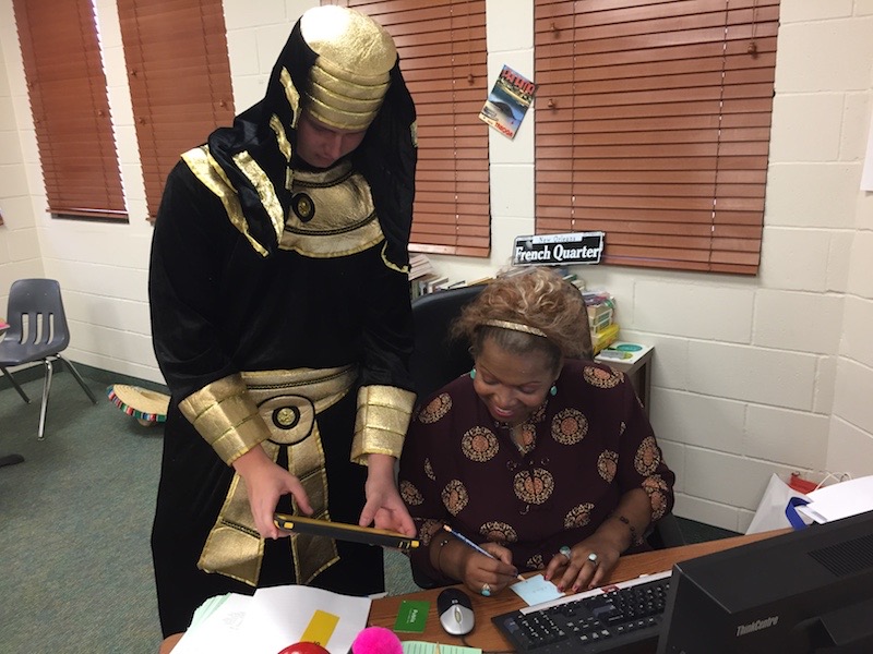 Junior Max Runde gets extra help from Profesora Loaiza, dressed as a pharaoh for Homecoming. 