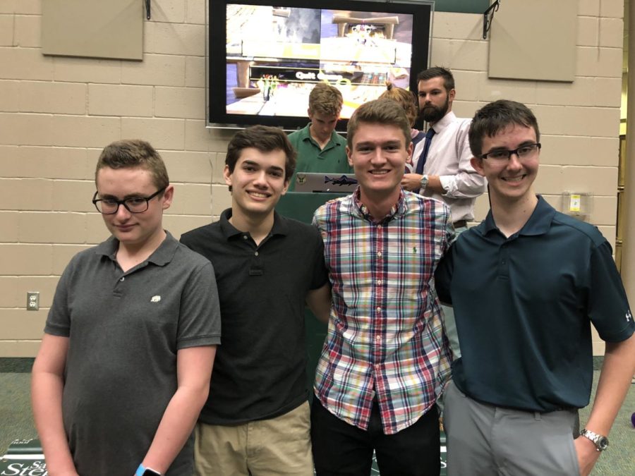 Click the image for full video.  Sam Cotter, Thomas Joyce, Matthew Thomas, and Luke Valadie battled it out in Mario Kart in from of the whole school for class spirit points. 