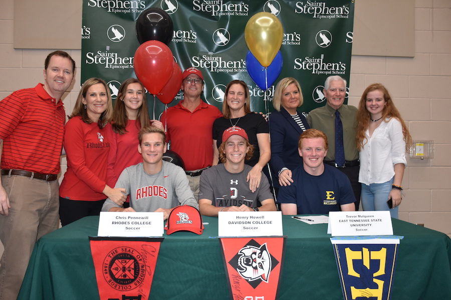 Families of the seniors gather for a photo. 