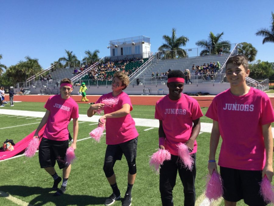 Junior boys Cheer Team practices their routines during the pre-game warm-up.