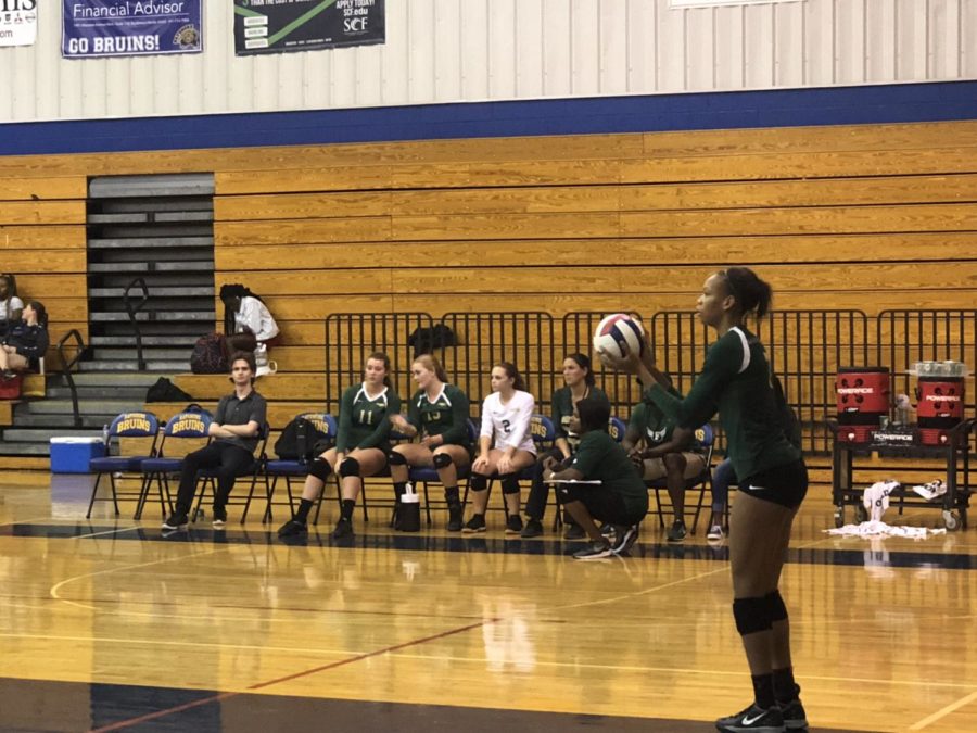 Junior Sarah Stevens prepares to serve the ball.