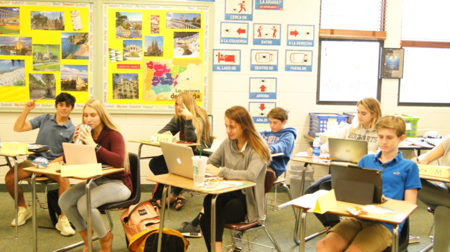 Students dive into a lesson in Mrs. Gustavus Class on their iPads and laptops.