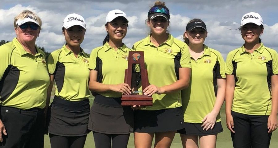 The varsity girls golf team after their regional championship. 