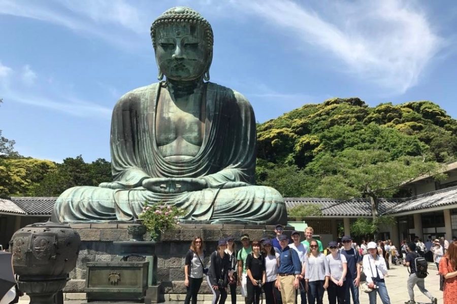 Students visit the Great Buddha of Kamakura at the Kotokuin Temple.