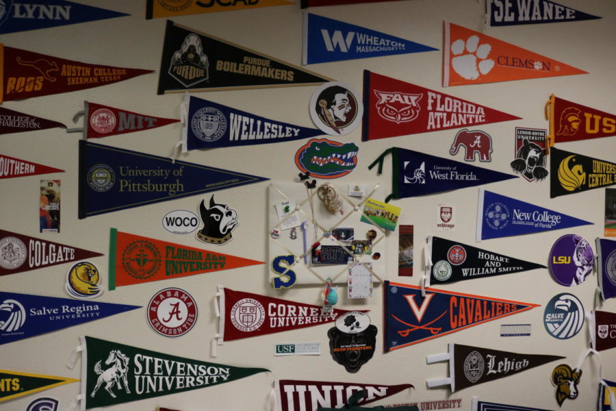 College pennants adorn the walls of the college counseling office.  