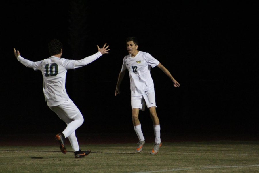 Seniors Noah LaBelle and Andy Sevilla celebrate a goal. 