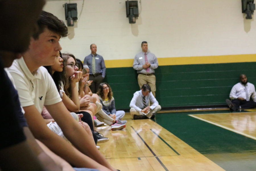 Students sit patiently as they watch the award ceremony.