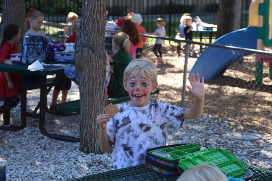 Lower school student dresses up as a happy scarecrow. 