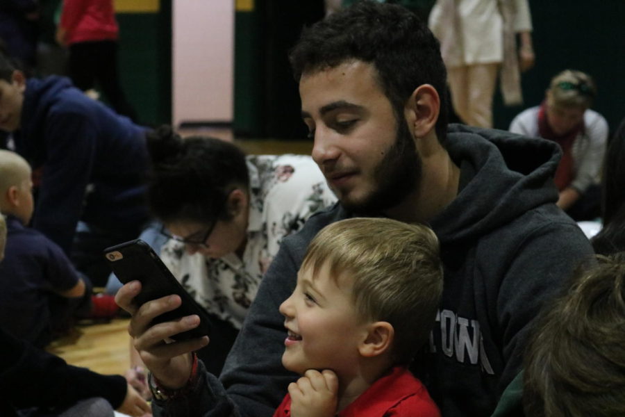 Senior Mark Gharby entertains his falcon friend.