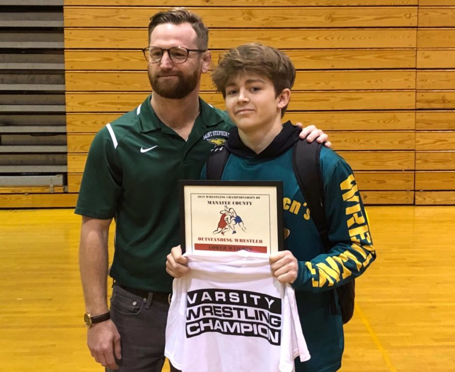 Jake Manning being awarded the county championship and Most Outstanding Wrestler this past weekend at Palmetto High School 