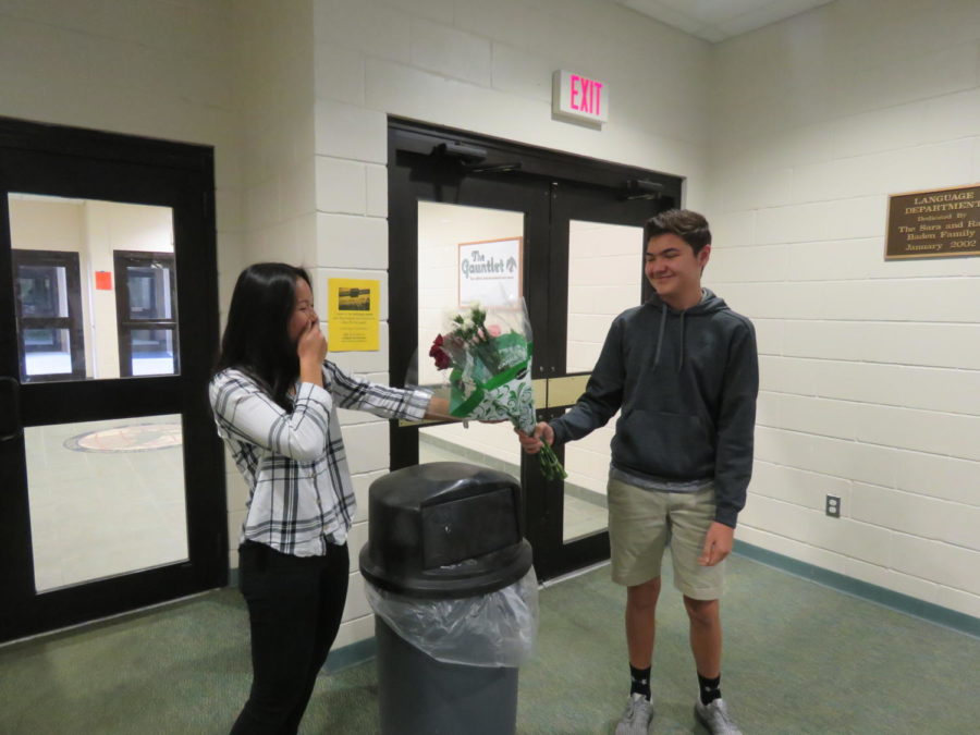 Chaz Oyler gives Allie Serterides a bouquet of carnations for Valentines Day