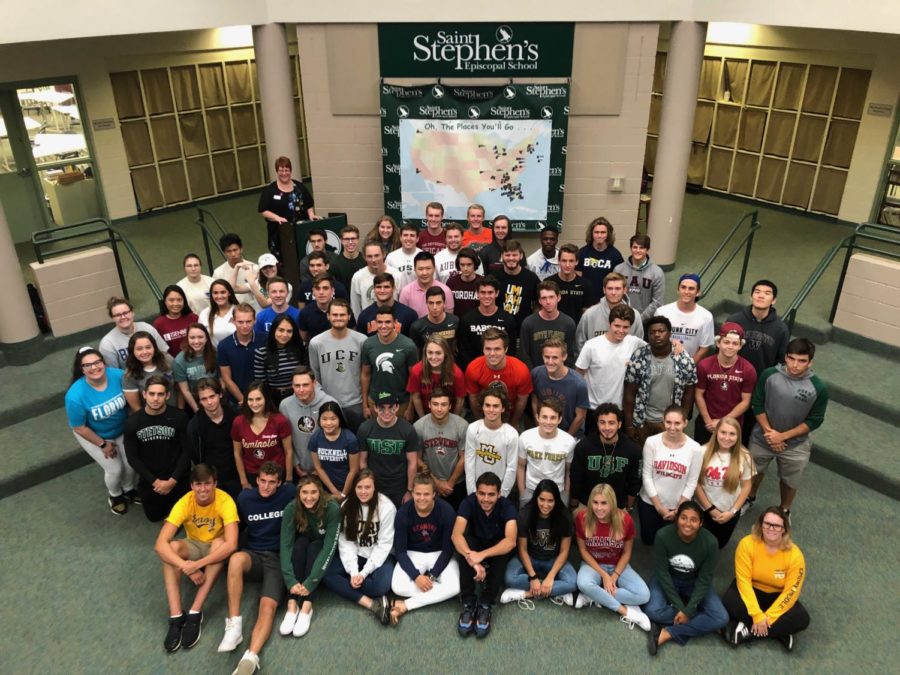 A group shot of departing seniors in their college gear. 