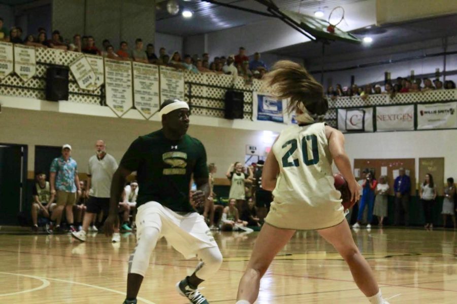 Senior Demi Harms looks at her team to make a pass.