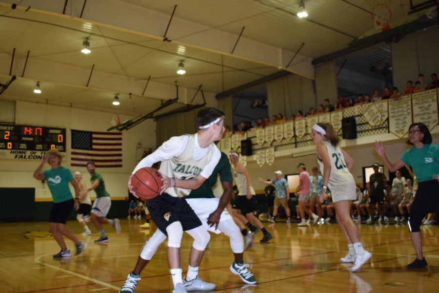 Senior Julian Sedillo defends the ball as his team runs down court.