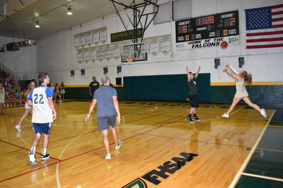 Senior Cate Mulqueen attempts a shot from the three point line.