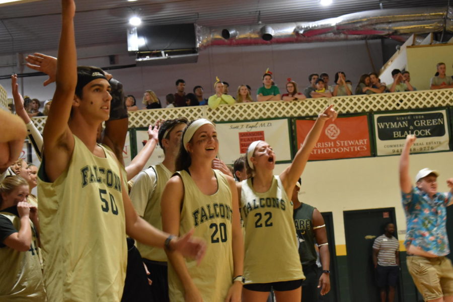 The student team celebrates a made basket.