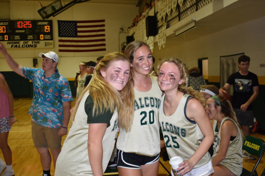 Seniors Avery Robinson, Jackie Schlossberg, and Kate Folkens smile despite being down against faculty.