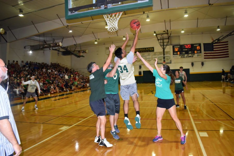 Junior Peter Balos goes up for a layup while heavily guarded.