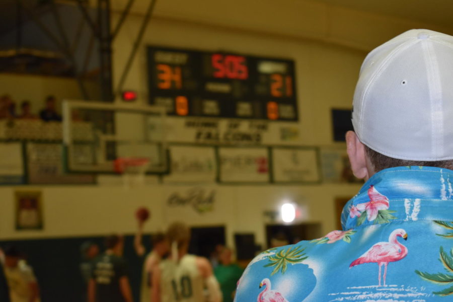 Senior coach Alex Sket looks upon the players in hopes of a basket.