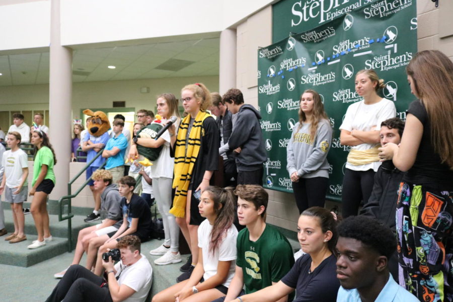 Students watch intently as senior Cate Mulqueen commentates the match. 