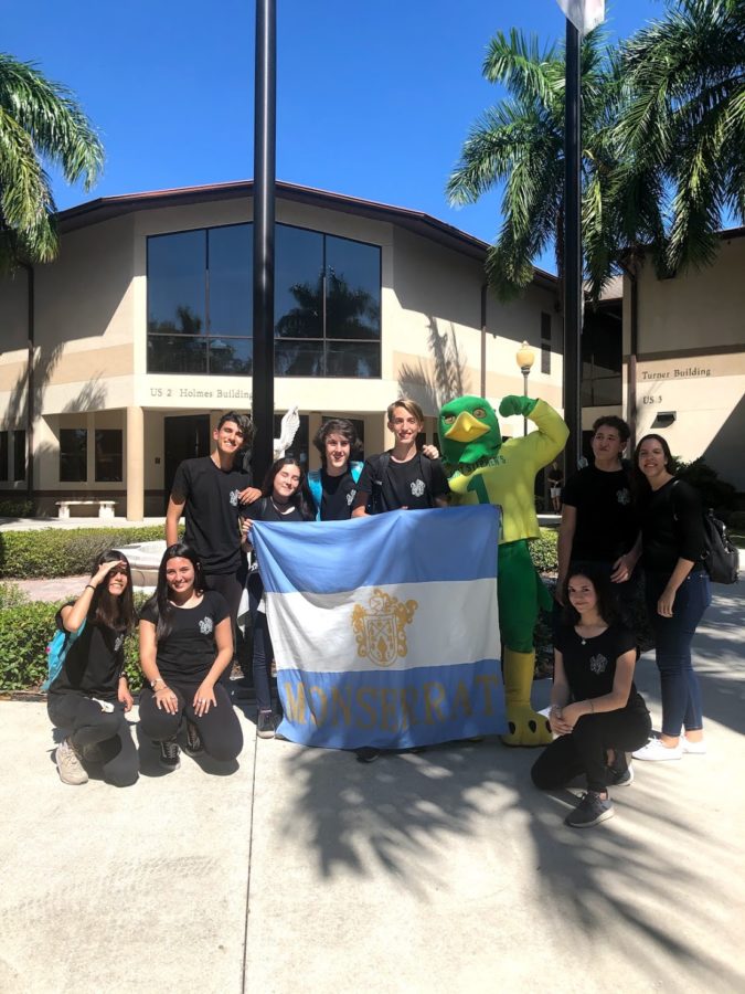 Freddy Falcon poses with Argentinian students in the palm 