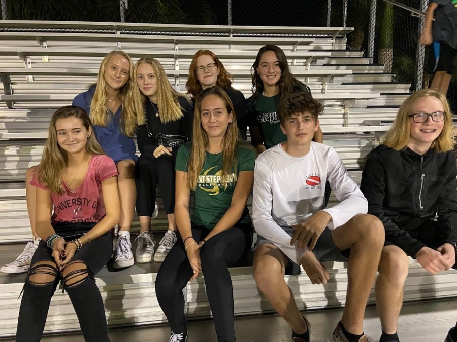 This picture at a football game the first night of the students arrival. There were about 10 different cameras taking pictures hence everyone looking in different directions. 
