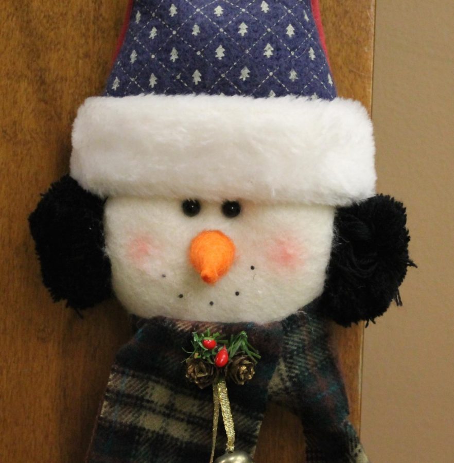 Mrs. Revard is getting into the Christmas spirit by putting up decorations like this one, a snowman door decoration! 