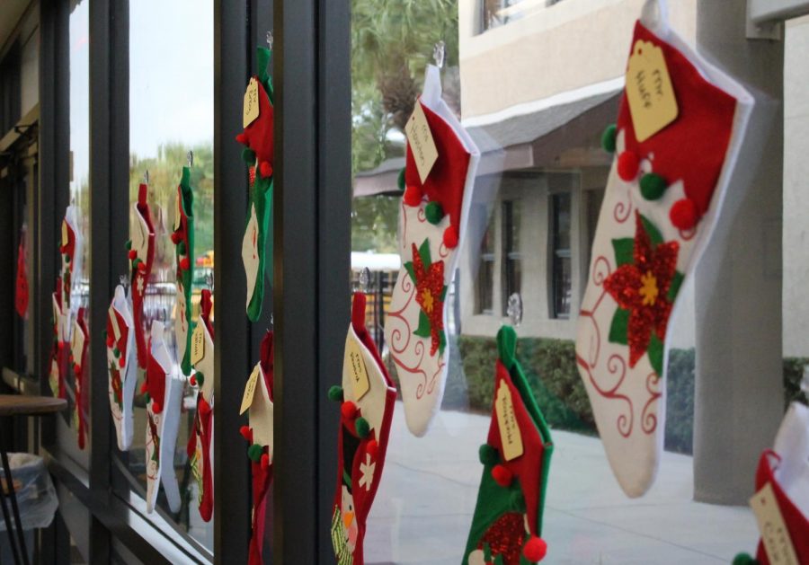 On the front glass of the Middle School, each teacher has their own Christmas stocking!