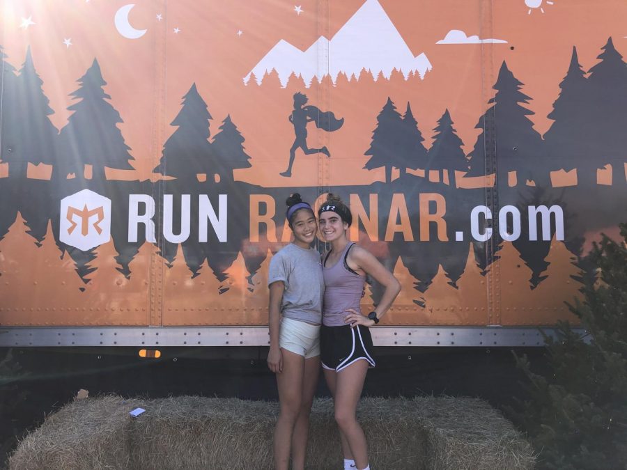 Post-race, junior Janie Chatham and senior Katie Lin pose for a picture celebrating their finish. 