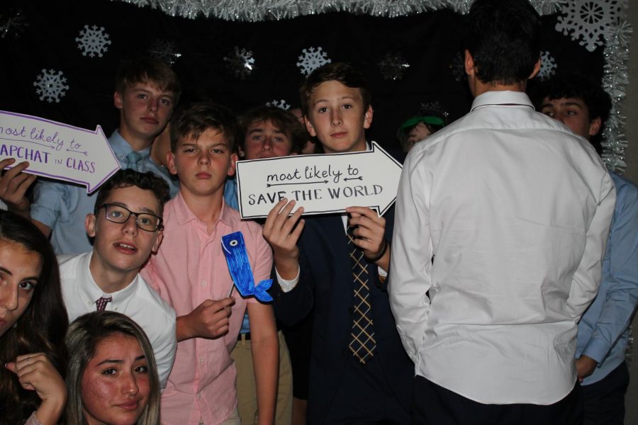 Eight grade students capture the night at the photo booth