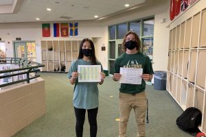 Allie Serterides and Gauntlet Editor-in-Chief Sully Maley display the old and new schedules.