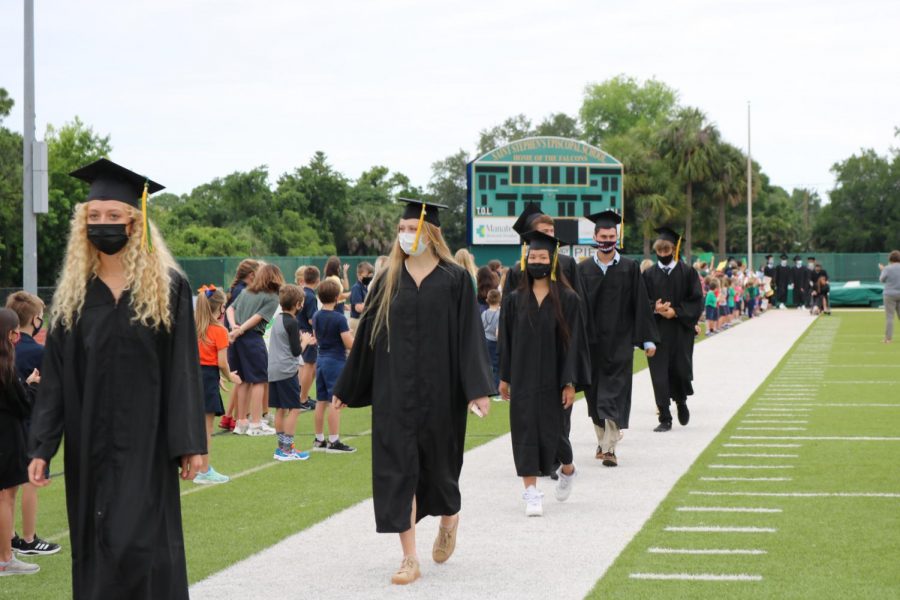 Here, 6 of our beloved Saint Stephens seniors walk the Senior Walk with pride.