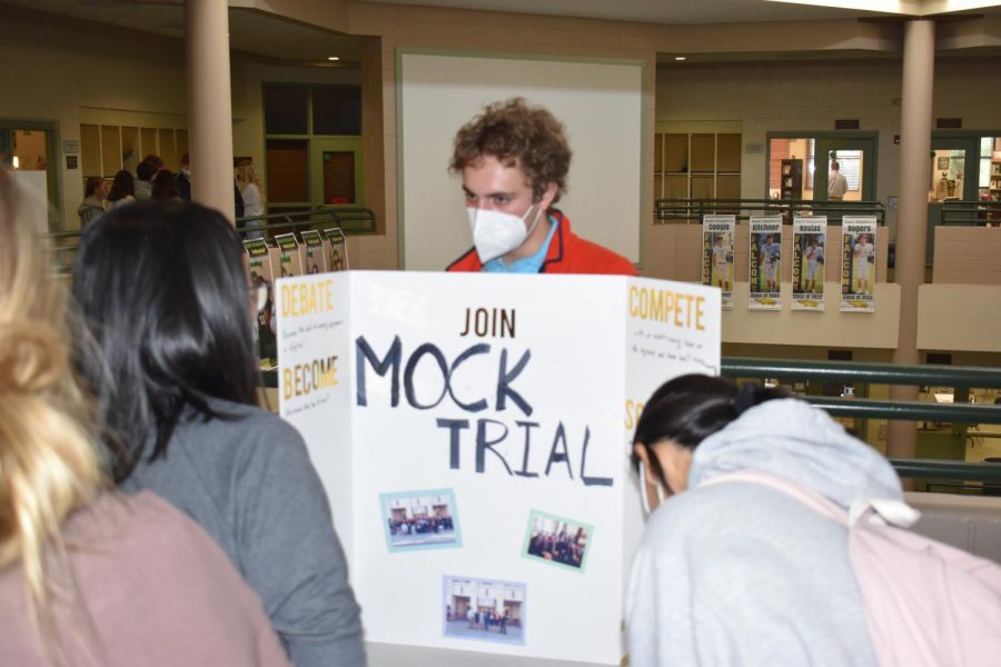 Senior Tyler Kadivar explains Mock Trial to classmate Angel Dai.