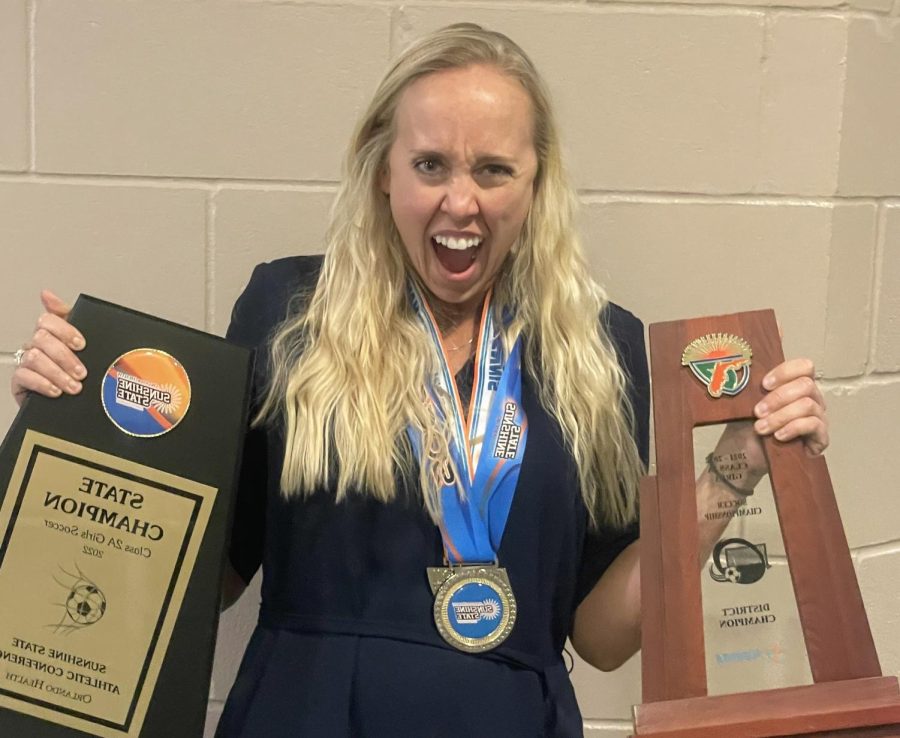 Mrs. Cotton enjoys her awards.