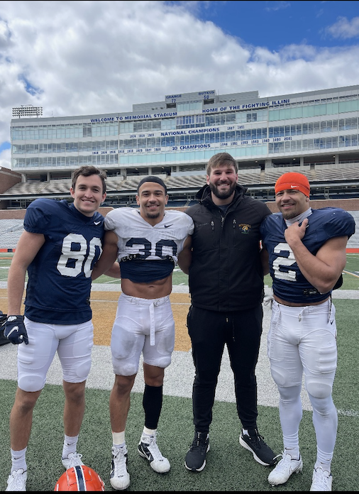 Peyton Vining, Sydney Brown, Dylan Davis, and Chase Brown meet up after practice at University of Illinois. 