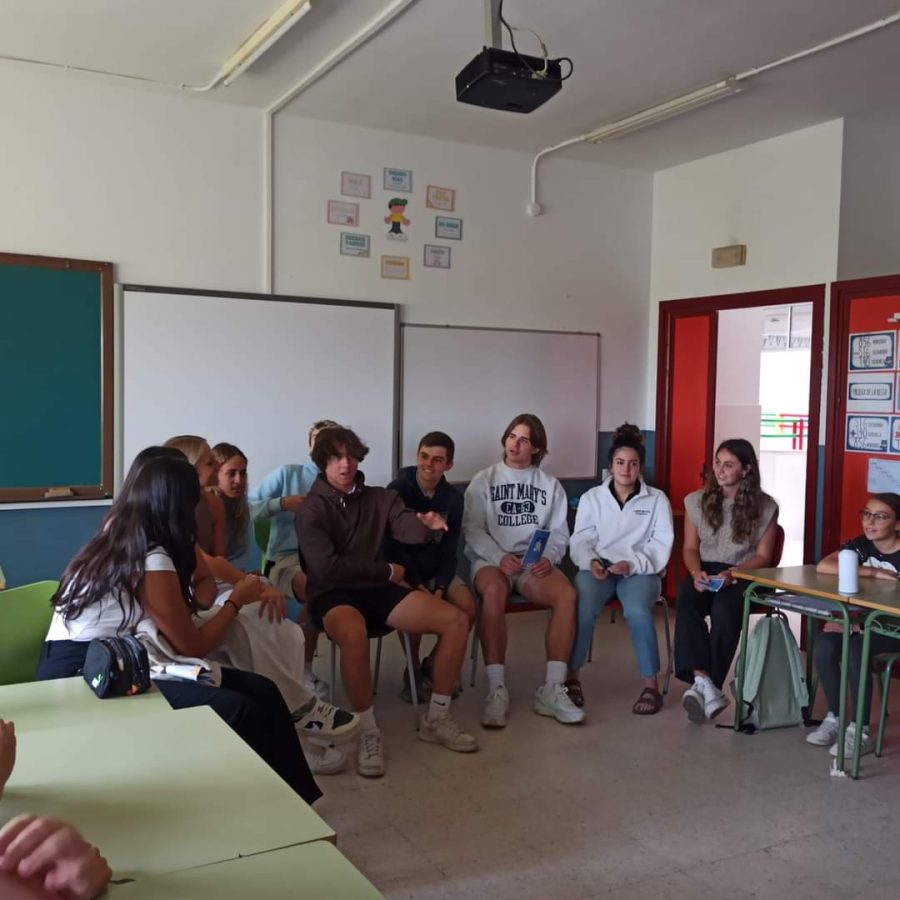 Senior Anthony Monetti shares his love of soccer with the primary students of Hernando De Soto School in Barcarrota