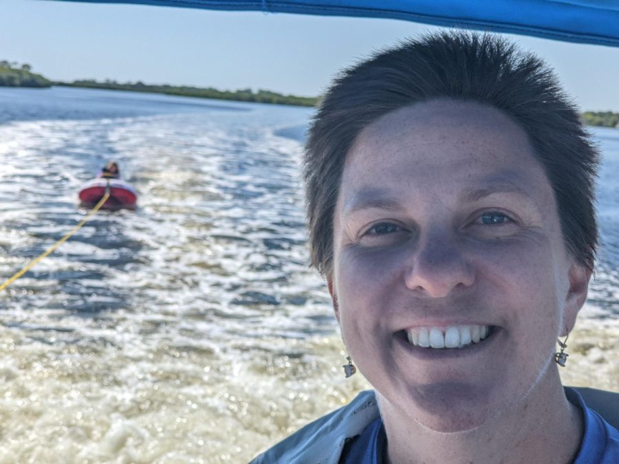 Mrs.+Paleczny+driving+her+boat+while+her+daughter%2C+Sally%2C+is+tubing+behind+her.%0A
