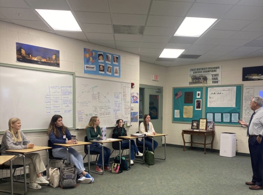 Mr. Yanelli welcomes Danish students Molly and Clara and their hosts Sophia Villaveces and Morgan Franklin to his Economics class. Photo submitted by Jackson Nealis.
