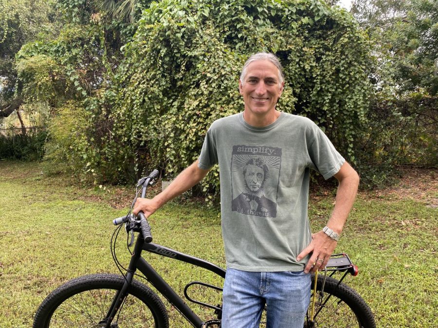 Mr. Johnson posing with his bike in his favorite shirt. 